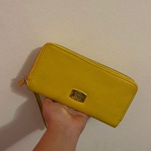 Joy Mangano wallet. Scratches on the front and a little scuff on the inside.